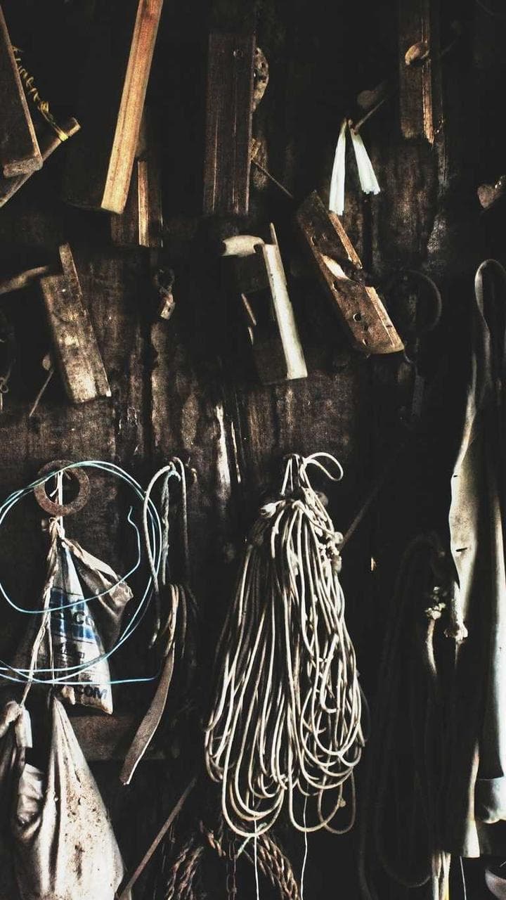 Hand tools hanging on the wall of a joinery workshop